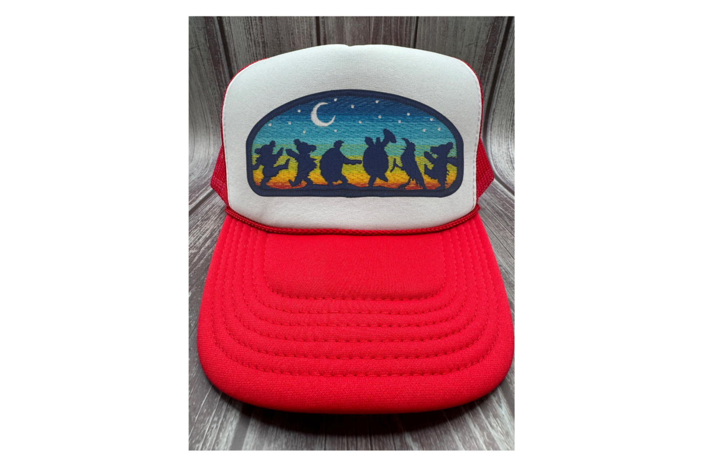 Red and white trucker hat with an embroidered Grateful Dead patch.